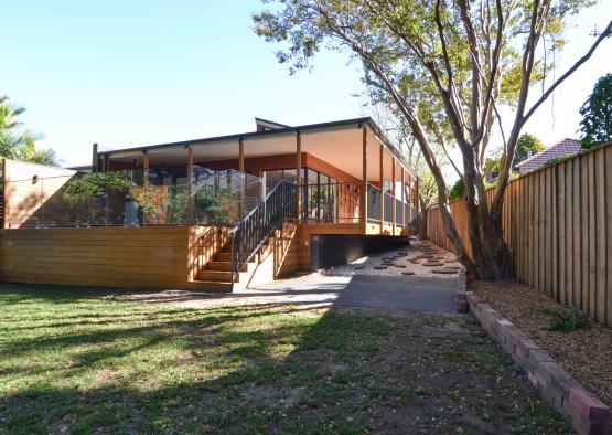 a house with a fence and grass