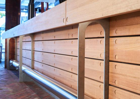 a wooden bar with metal pipes