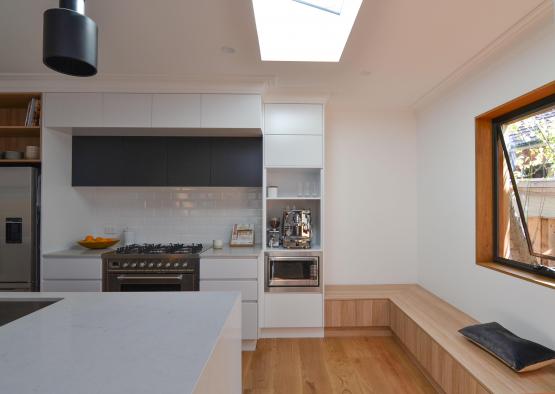 a kitchen with a bench and a bench