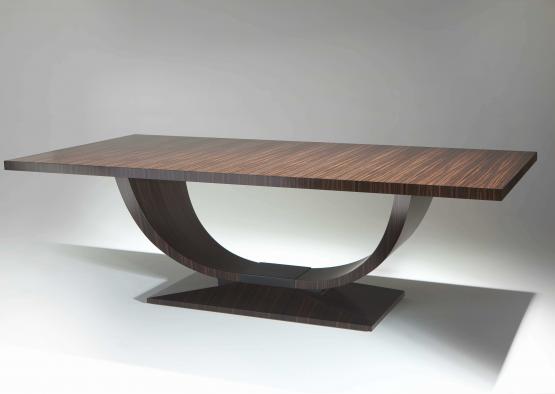 a brown table with a curved base