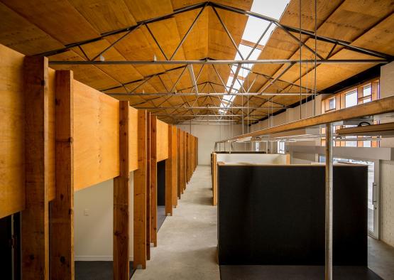a room with cubicles and a ceiling