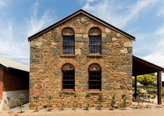 a stone building with a roof