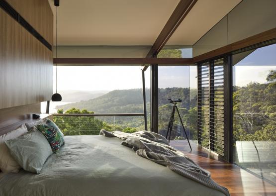 a bedroom with a view of the mountains