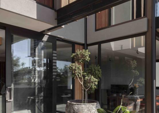 a table and chairs outside of a house