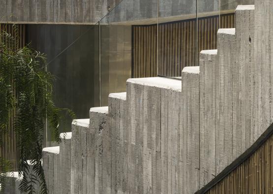 a concrete staircase with glass walls