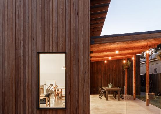 a wooden house with a glass window