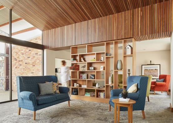 a room with a blue couch and a blue chair