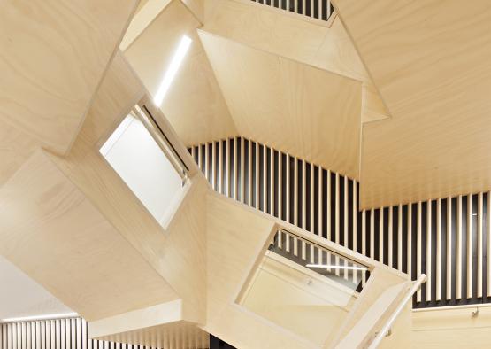 a wooden staircase with a triangular design