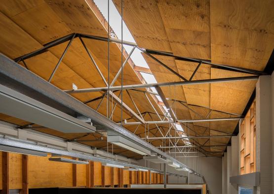 a ceiling with beams and a window