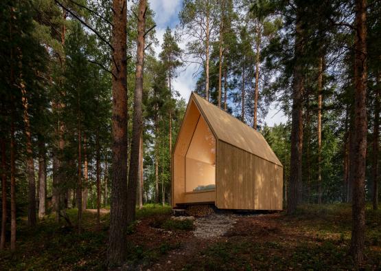 a small wooden cabin in the woods