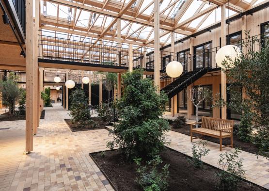 a building with a courtyard and trees