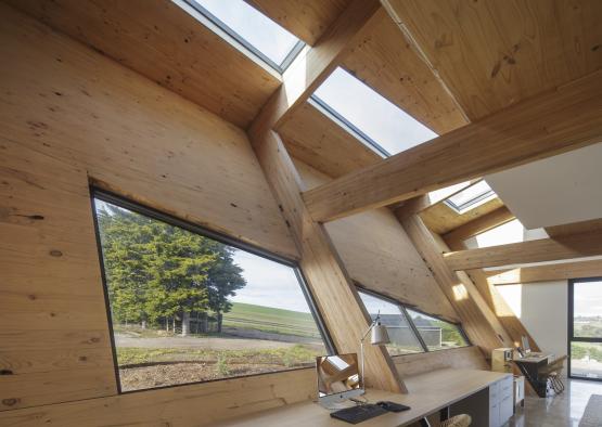 a desk in a room with skylights