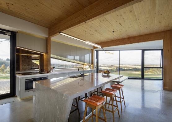 a large kitchen with a large island and stools