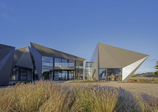 a building with a triangular shaped roof