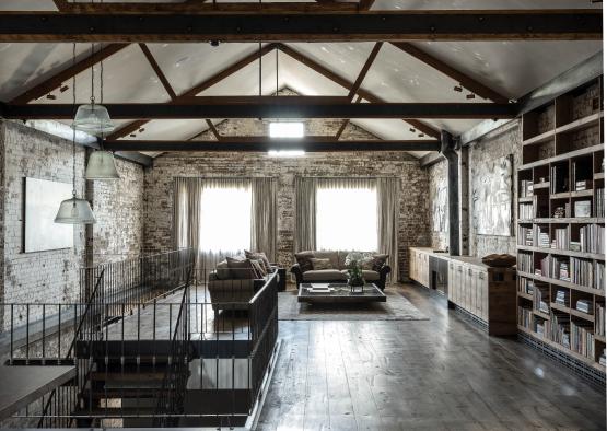 a room with a metal railing and a couch