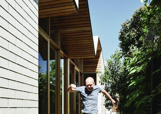 a man running outside of a house