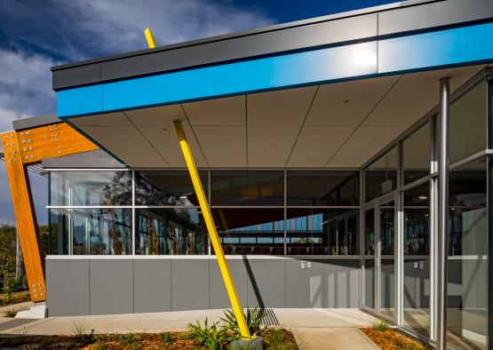 a building with a yellow pole