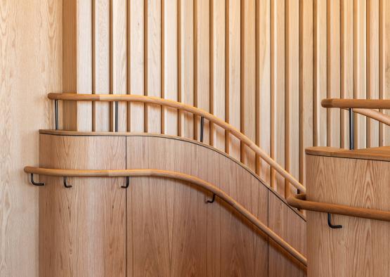 a wooden staircase with handrails