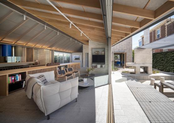 a living room with a couch and a kitchen