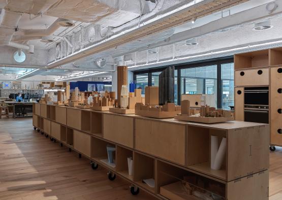 a room with shelves and wooden furniture