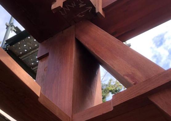 a wood structure with a cross