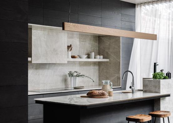 a kitchen with a countertop and stools