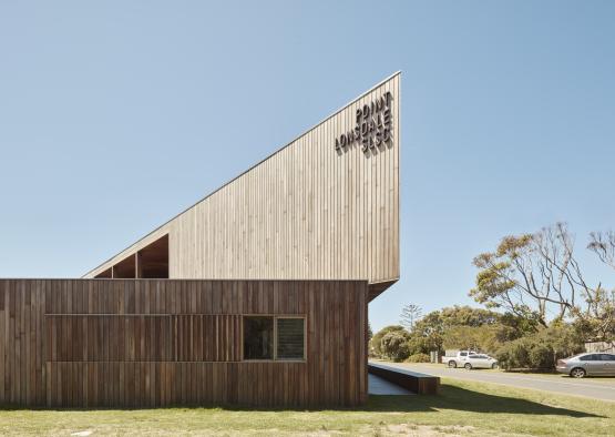 a building with a triangular shaped roof