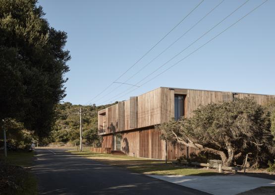 a building with trees and power lines