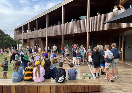 a group of people sitting on a deck