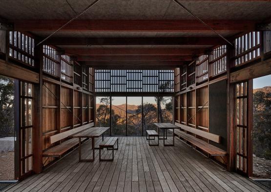 a room with benches and tables