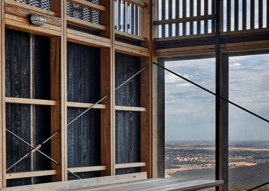 a wooden bench and a window