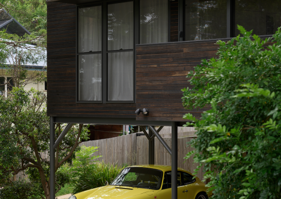 a yellow car parked in a driveway