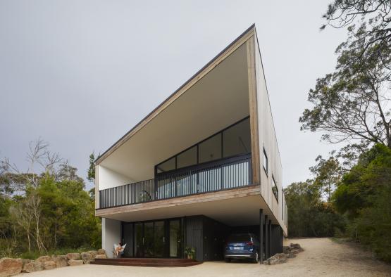 a house with a car parked in front of it