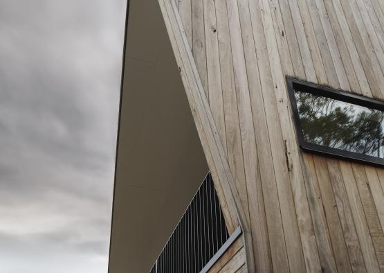 a wooden building with a triangular roof