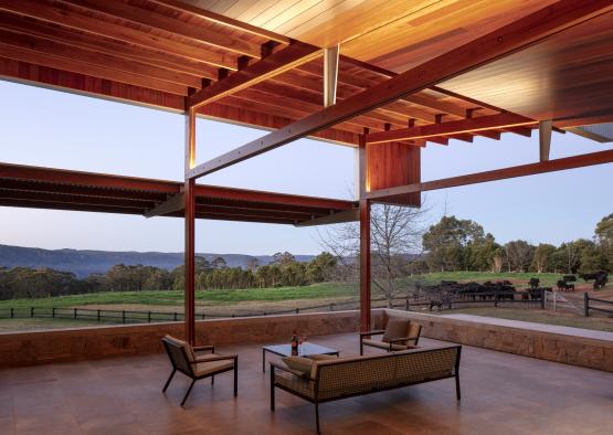 a patio with a couch and chairs