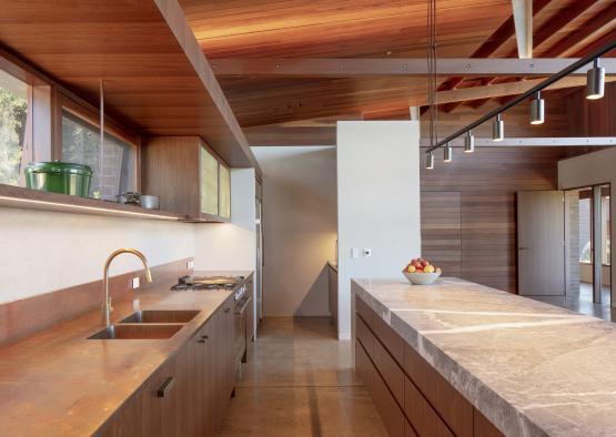 a kitchen with a large countertop and a large sink