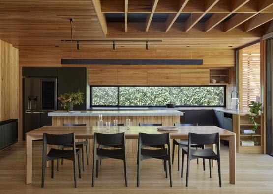 a dining table and chairs in a room