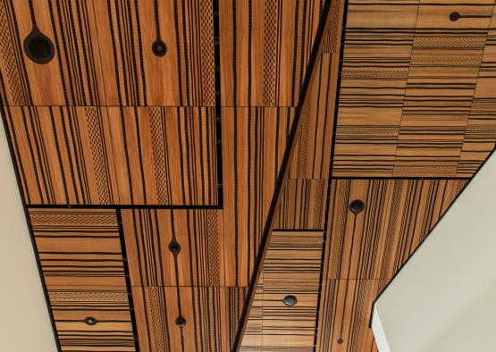 a wood paneled ceiling with black lines
