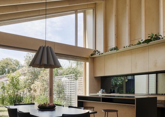 a dining room with a table and chairs