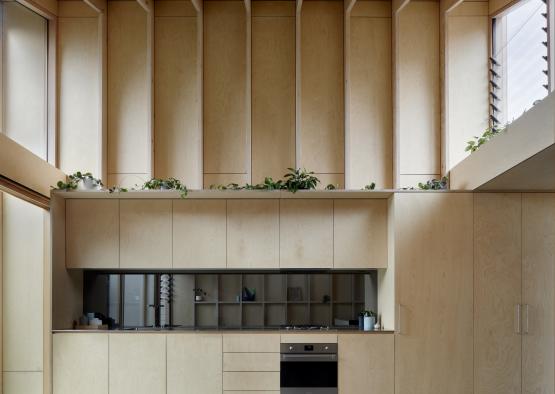 a kitchen with a large ceiling