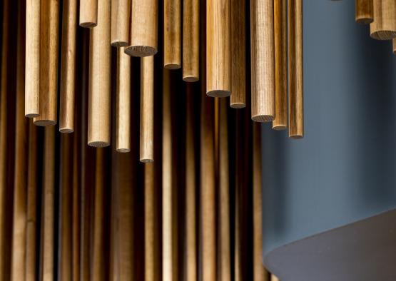 a group of wooden sticks from a ceiling