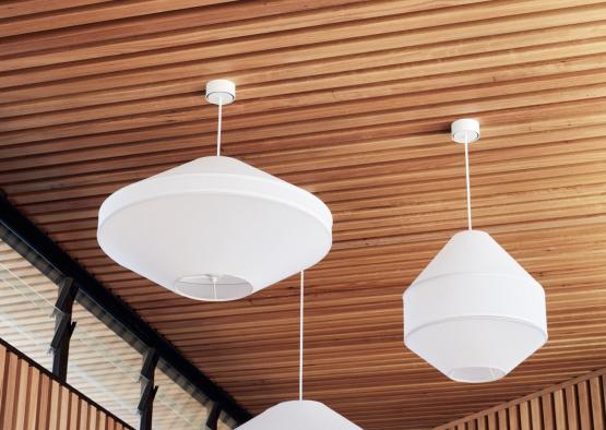 a group of white lamps from the ceiling