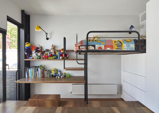 a bunk bed with toys on shelves