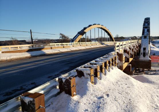 a bridge with snow on the ground