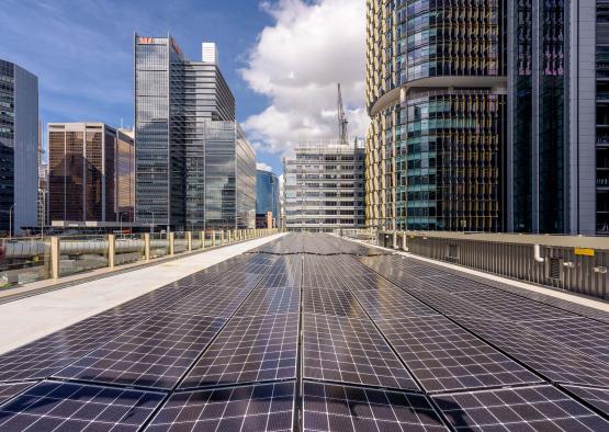a solar panels on a walkway in a city