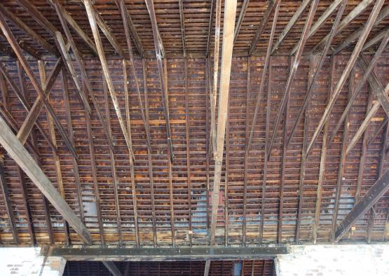 a wooden structure with beams