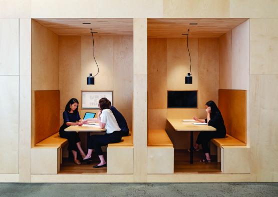 a group of people sitting at tables