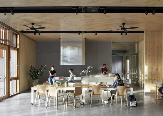 people sitting at a table in a room