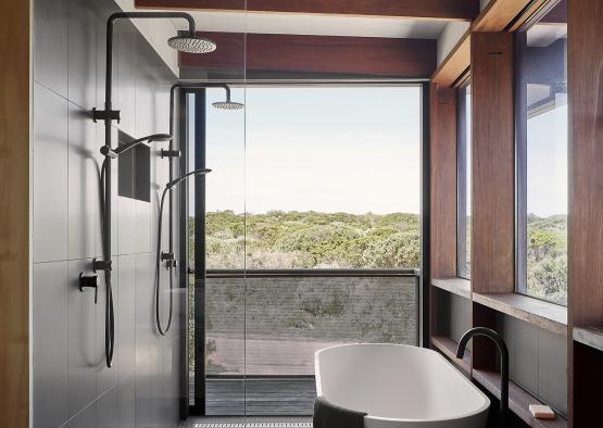 a bathroom with a tub and shower