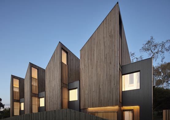 a building with a triangular shaped roof